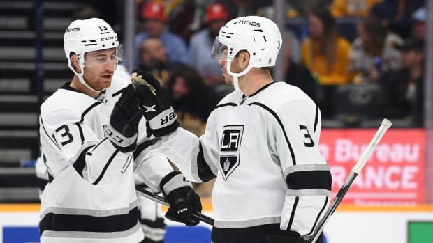 Oct 18, 2022; Nashville, Tennessee, USA; Los Angeles Kings defenseman Matt Roy (3) celebrates with center Gabriel Vilardi (13) after a goal during the third period against the Nashville Predators at Bridgestone Arena. Mandatory Credit: Christopher Hanewinckel-USA TODAY Sports